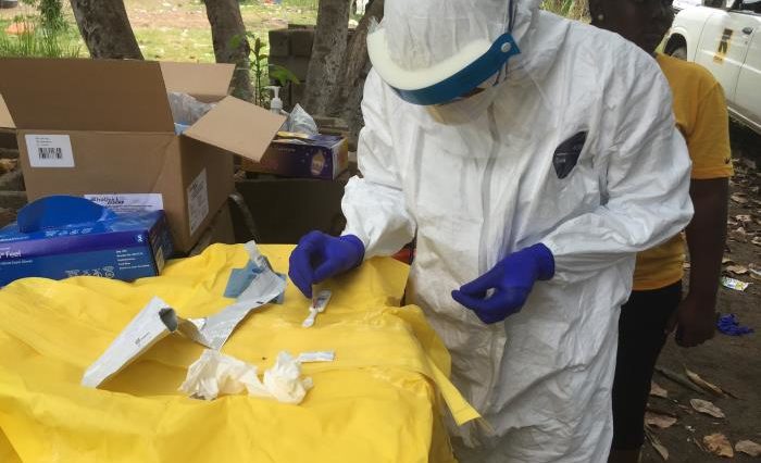 Epidemiologist Conducts Rapid Ebolavirus Diagnostic Assay