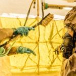 An officer from the NYPD COBRA unit goes through decontamination during the joint military-civilian CBRN defense exercise. Credit: Harley Jelis NYPD COBRA Decontamination Exercise