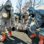 CBRN soldiers and police officers move a simualted casualty during an exercise at the NYPD’s Rodman's Neck Tactical Village Credit: Harley Jelis CBRN Soldiers and NYPD Officers Patient Evacuation Exercise